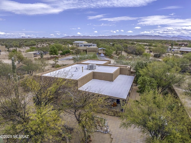 birds eye view of property with a mountain view