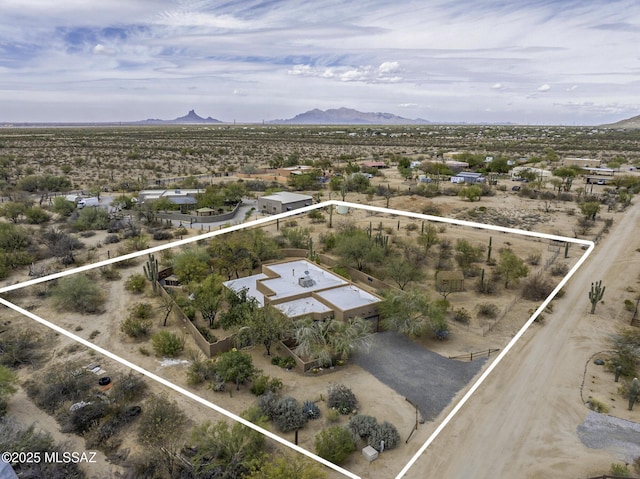 drone / aerial view with a mountain view and a desert view