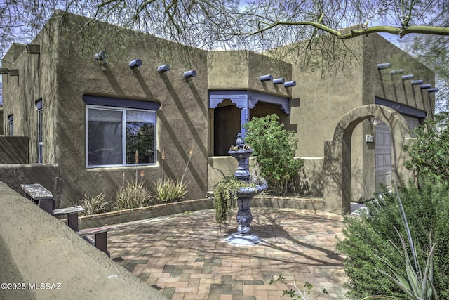 view of pueblo revival-style home