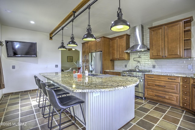 kitchen with backsplash, appliances with stainless steel finishes, wall chimney range hood, and open shelves