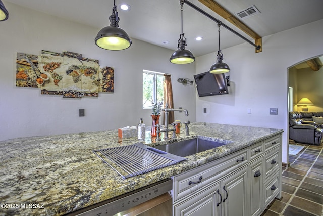 kitchen featuring visible vents, stone counters, recessed lighting, arched walkways, and dishwasher