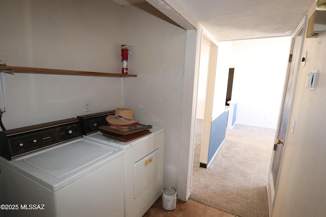 washroom with independent washer and dryer, laundry area, and light colored carpet