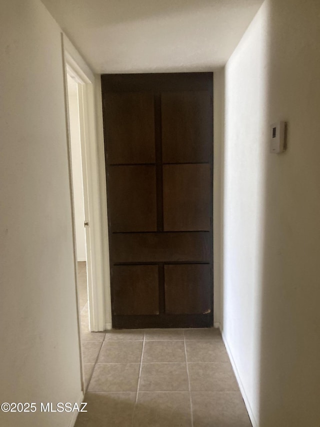 hallway with light tile patterned floors