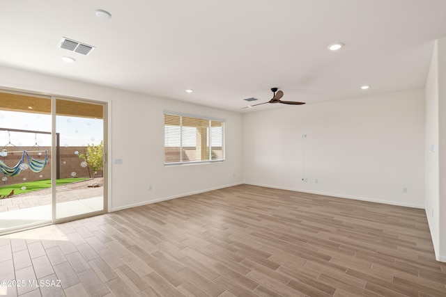 empty room featuring a ceiling fan, recessed lighting, light wood-style floors, and visible vents