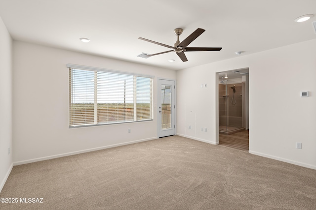 carpeted spare room with recessed lighting, visible vents, baseboards, and a ceiling fan