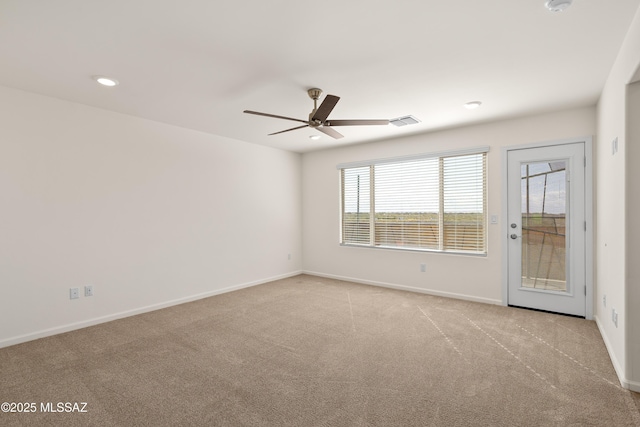 carpeted spare room with visible vents, recessed lighting, a ceiling fan, and baseboards