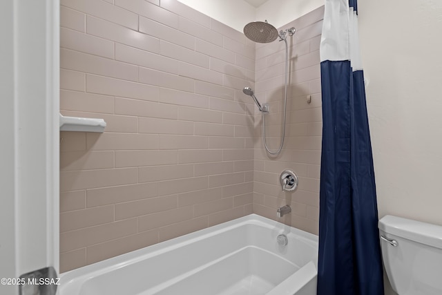 bathroom with toilet and shower / tub combo with curtain