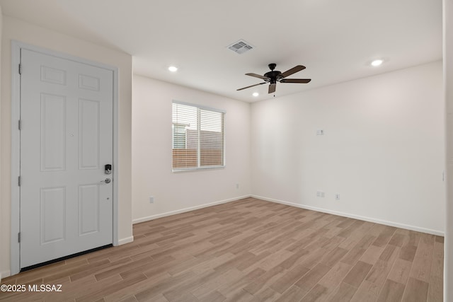 spare room featuring a ceiling fan, recessed lighting, light wood-style floors, and visible vents