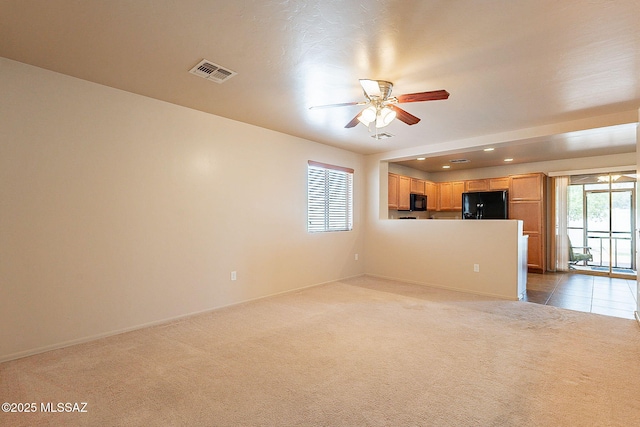 unfurnished living room featuring ceiling fan, visible vents, recessed lighting, and carpet