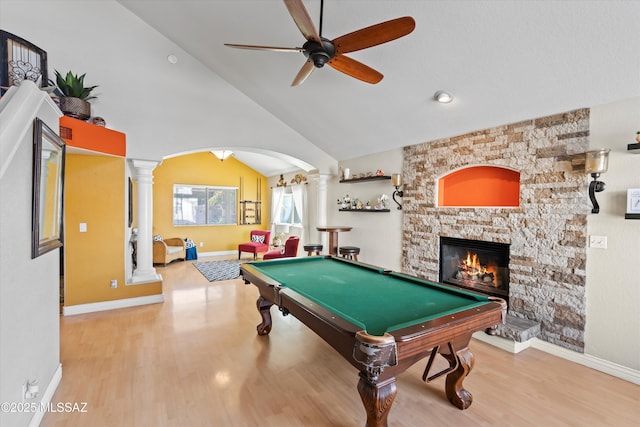 playroom with a stone fireplace, a ceiling fan, billiards, and ornate columns