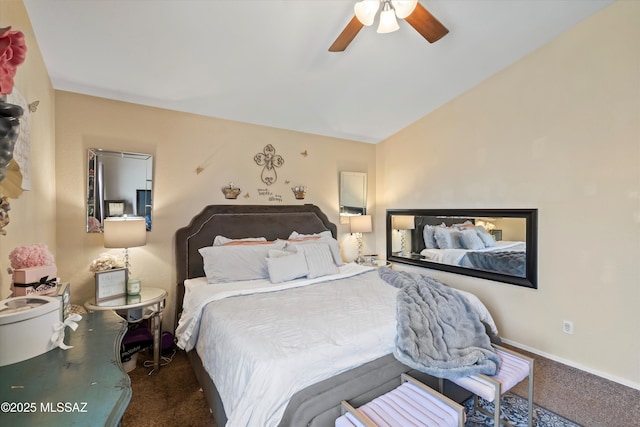 carpeted bedroom with baseboards, lofted ceiling, and a ceiling fan