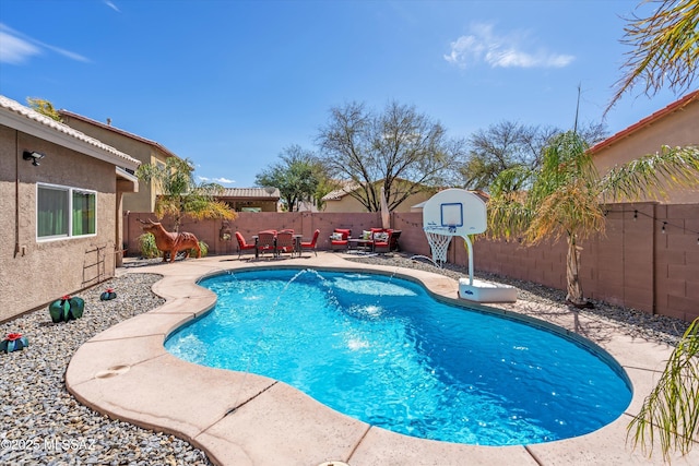 view of swimming pool with a fenced in pool, a patio, and a fenced backyard