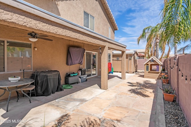 view of patio / terrace featuring a ceiling fan, a fenced backyard, and a grill