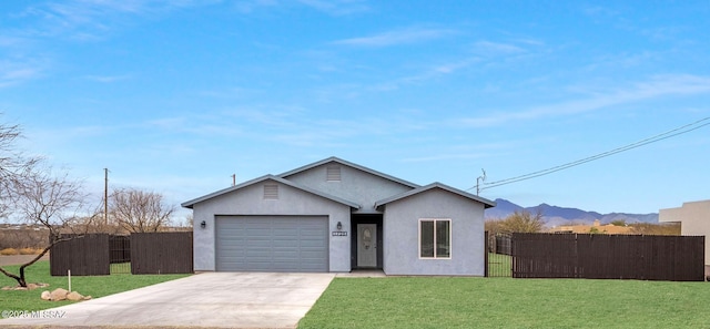 view of front of property featuring stucco siding, a front lawn, fence, concrete driveway, and an attached garage