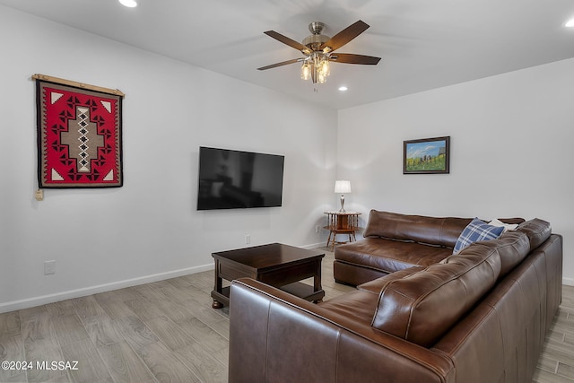 living area featuring recessed lighting, baseboards, a ceiling fan, and light wood finished floors