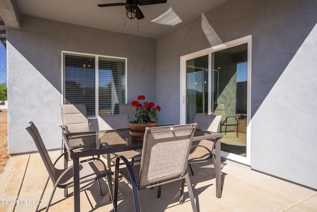 view of patio / terrace with outdoor dining space and ceiling fan