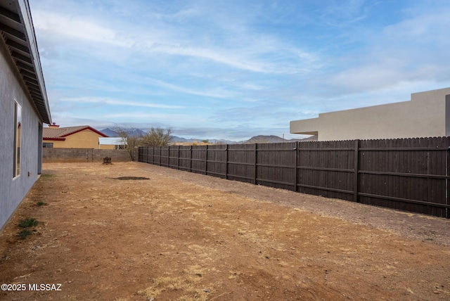 view of yard with a fenced backyard