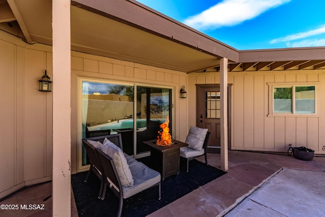 view of patio / terrace with an outdoor fire pit