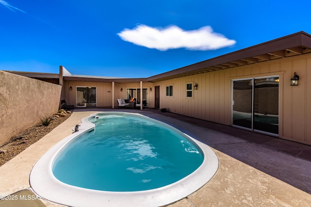 outdoor pool with a patio