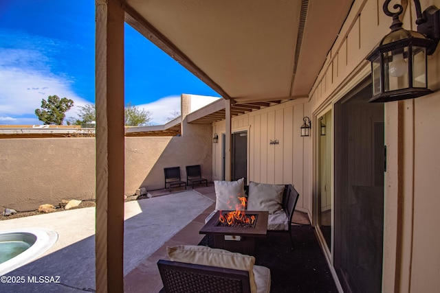 view of patio featuring an outdoor fire pit