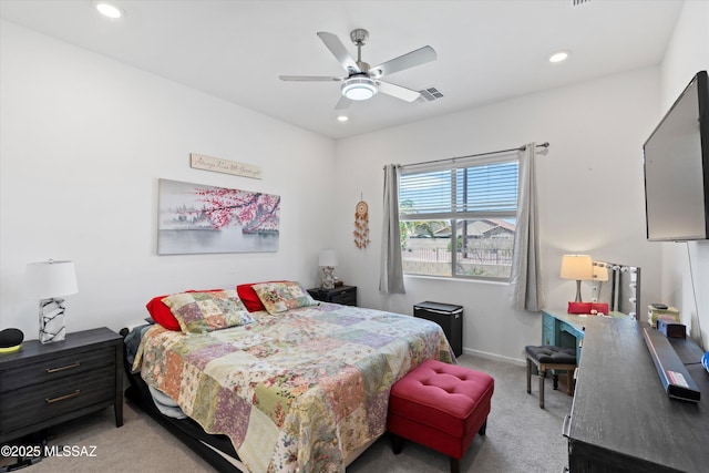 carpeted bedroom featuring visible vents, recessed lighting, baseboards, and a ceiling fan