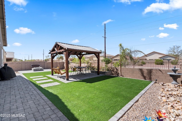 view of yard with a gazebo, a fenced backyard, and a patio