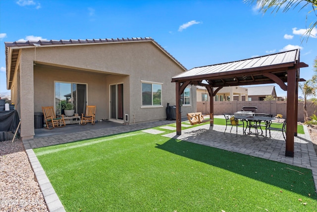 view of yard with a gazebo, a patio area, and fence