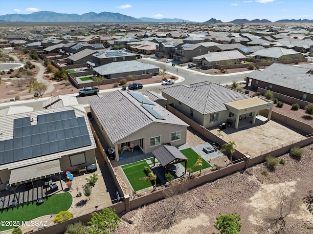 drone / aerial view featuring a residential view and a mountain view