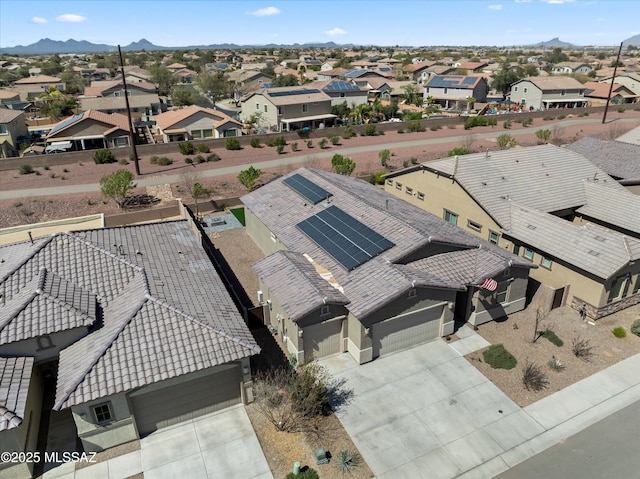 drone / aerial view with a mountain view and a residential view