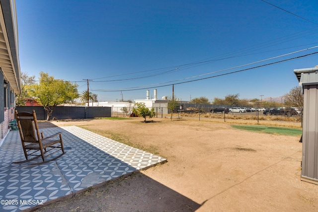 view of yard with a fenced backyard and a patio area