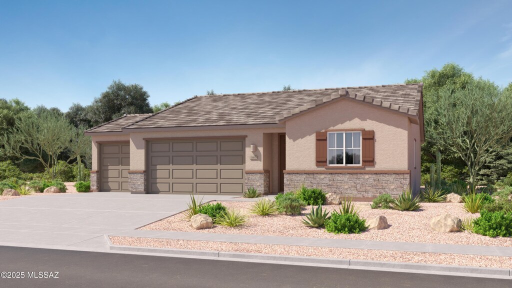 view of front of home with concrete driveway, a tile roof, stucco siding, a garage, and stone siding