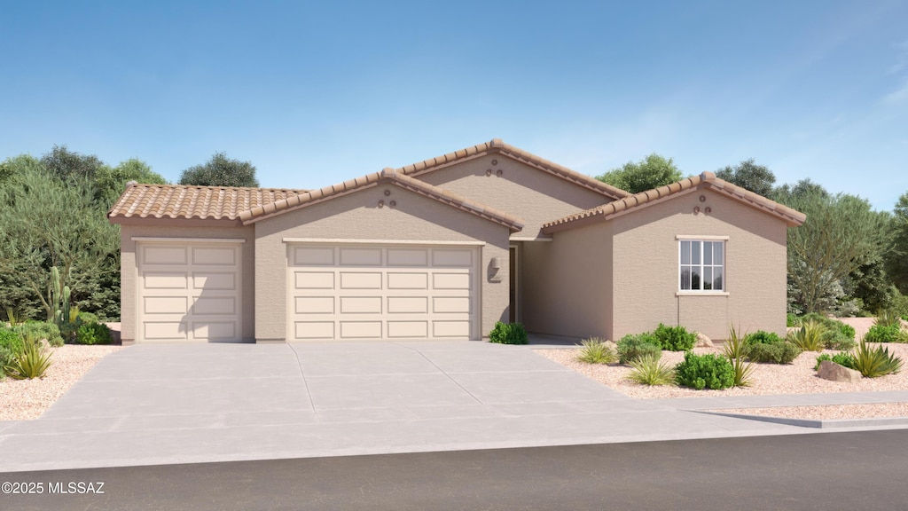 mediterranean / spanish-style house with stucco siding, a tiled roof, an attached garage, and driveway