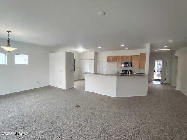 kitchen with recessed lighting, hanging light fixtures, black microwave, light colored carpet, and brown cabinets