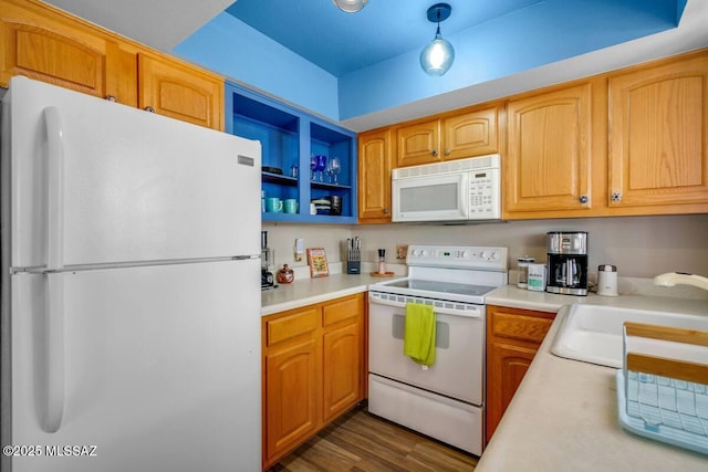 kitchen with open shelves, white appliances, light countertops, a sink, and dark wood finished floors