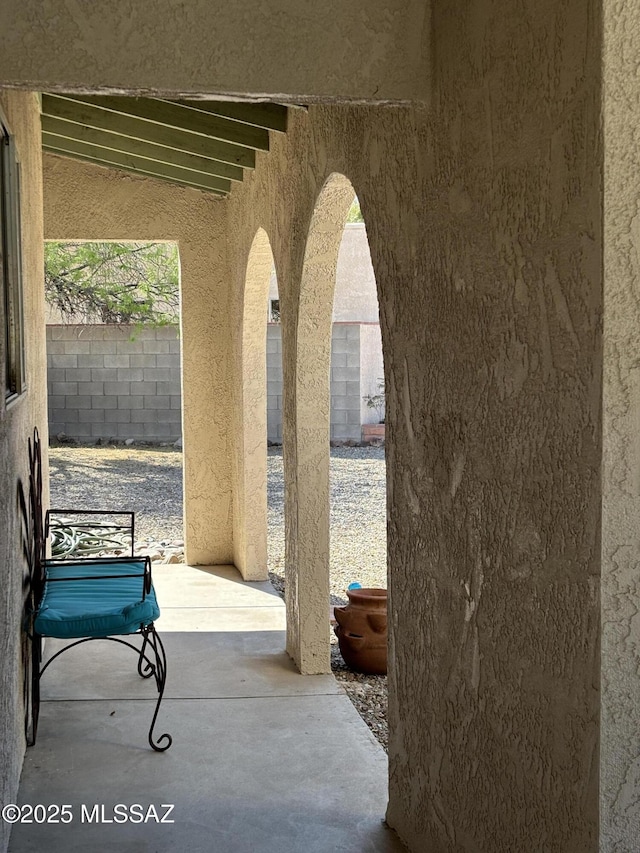 view of patio / terrace featuring fence