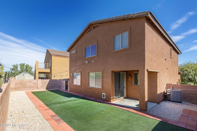 back of property featuring cooling unit, a patio, a fenced backyard, and stucco siding