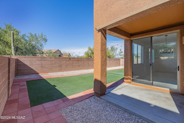 view of yard with a patio area and a fenced backyard