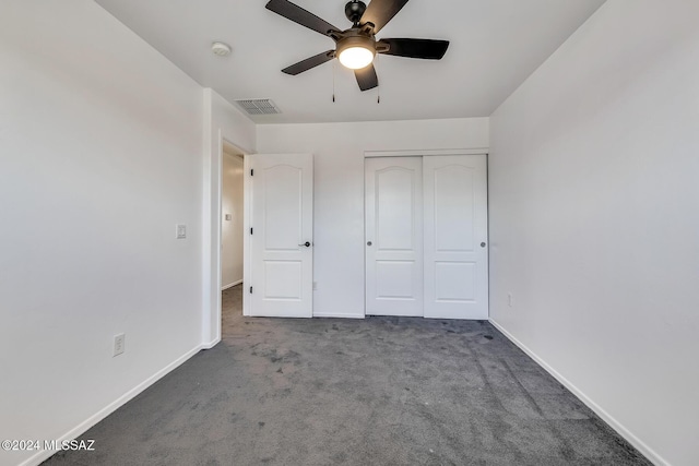 unfurnished bedroom with visible vents, baseboards, carpet flooring, a closet, and a ceiling fan