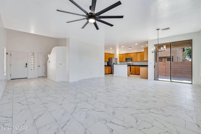 unfurnished living room featuring recessed lighting, visible vents, marble finish floor, and ceiling fan with notable chandelier