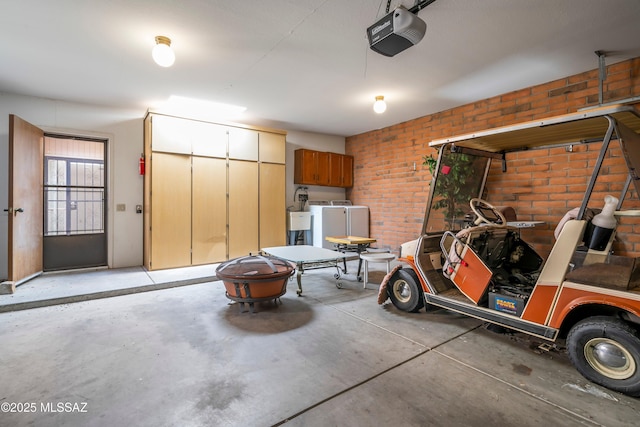 garage with a sink and a garage door opener