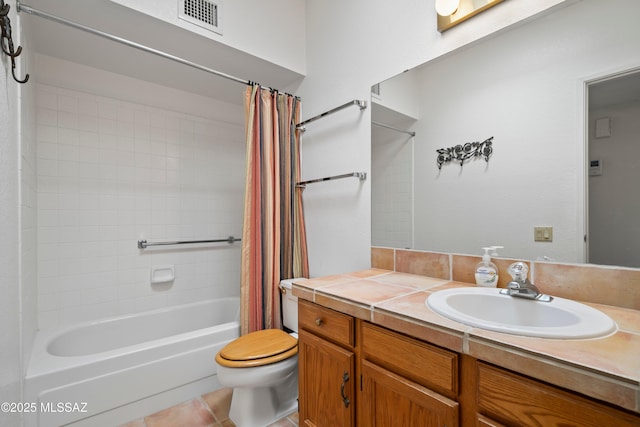 full bathroom featuring vanity, visible vents, toilet, tile patterned flooring, and shower / bath combo with shower curtain