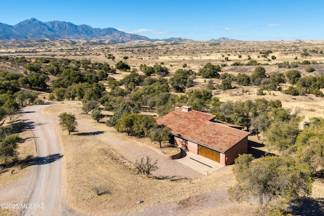 drone / aerial view featuring a mountain view