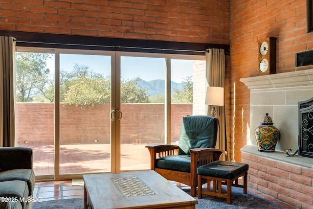 interior space featuring a mountain view and brick wall