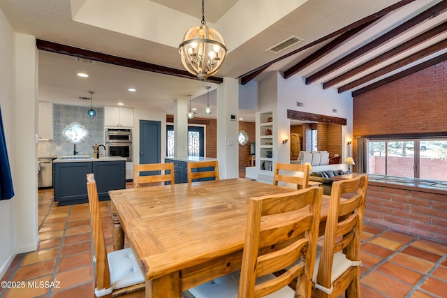 dining area featuring visible vents, an inviting chandelier, light tile patterned flooring, brick wall, and vaulted ceiling with beams