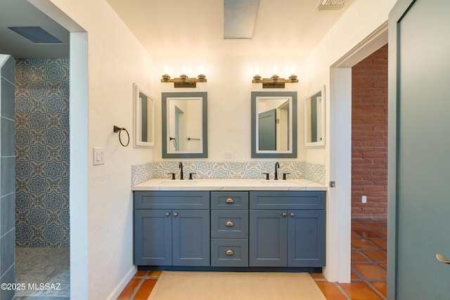 full bath featuring double vanity, tile patterned flooring, a walk in shower, and a sink