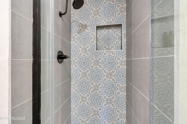 full bathroom with a tile shower