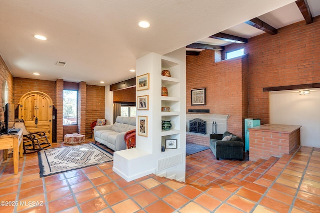 tiled bedroom with visible vents, multiple windows, beam ceiling, and a fireplace