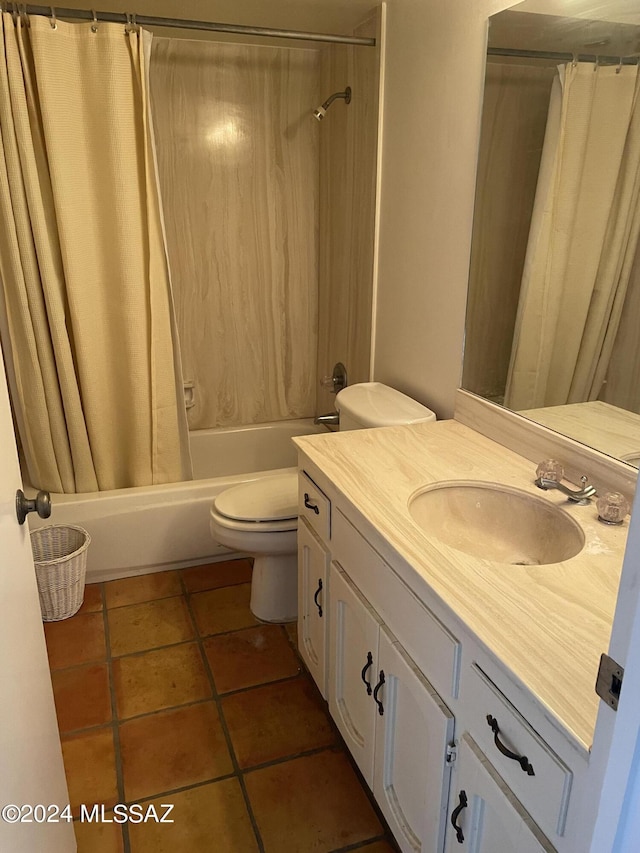 bathroom featuring tile patterned flooring, vanity, toilet, and shower / tub combo