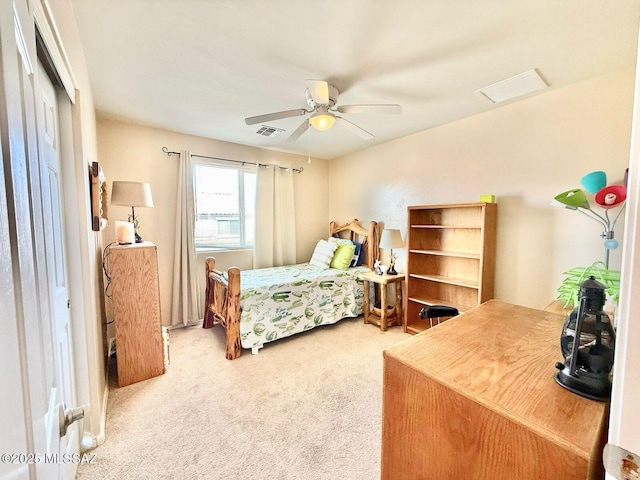 carpeted bedroom featuring visible vents and ceiling fan
