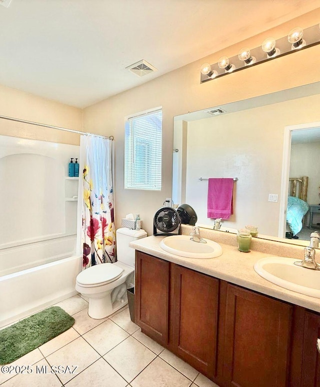 full bath with tile patterned flooring, double vanity, visible vents, and a sink
